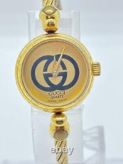 Read Gucci 2047L Gold Dial Gold Cable Bangle Watch Not tested For Parts F/S